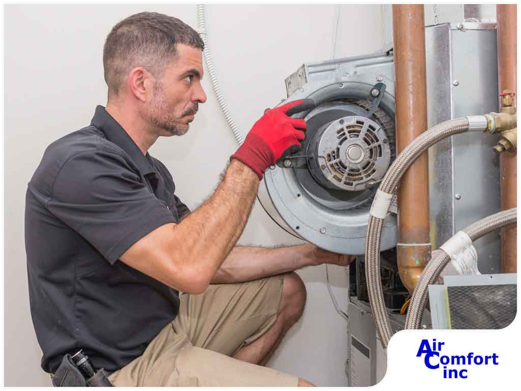 Technician repairing HVAC system