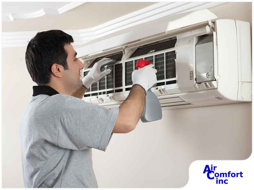 Air conditioner maintenance in progress