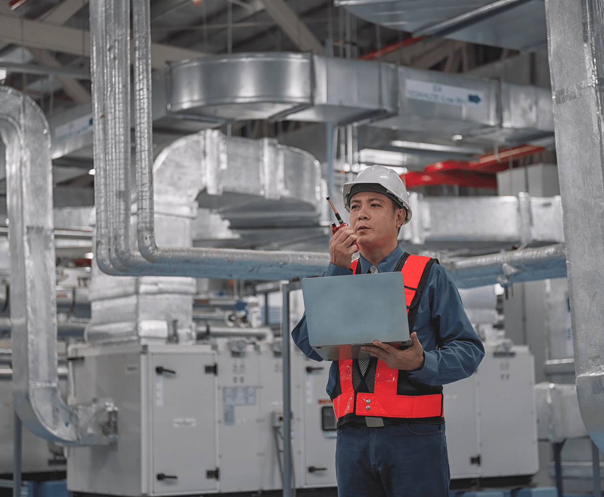 Engineer inspecting industrial HVAC system