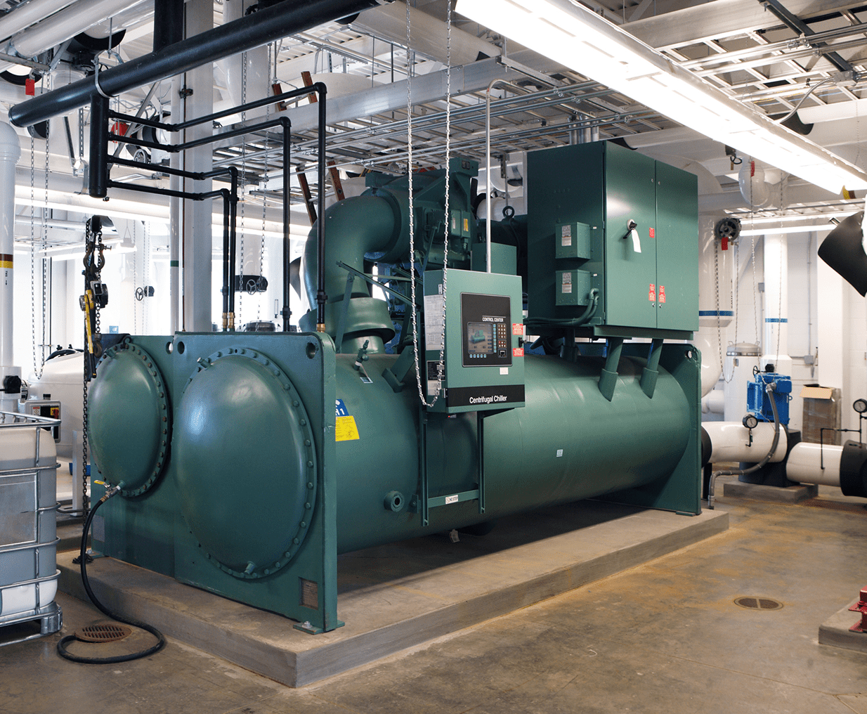 Large green industrial equipment indoors